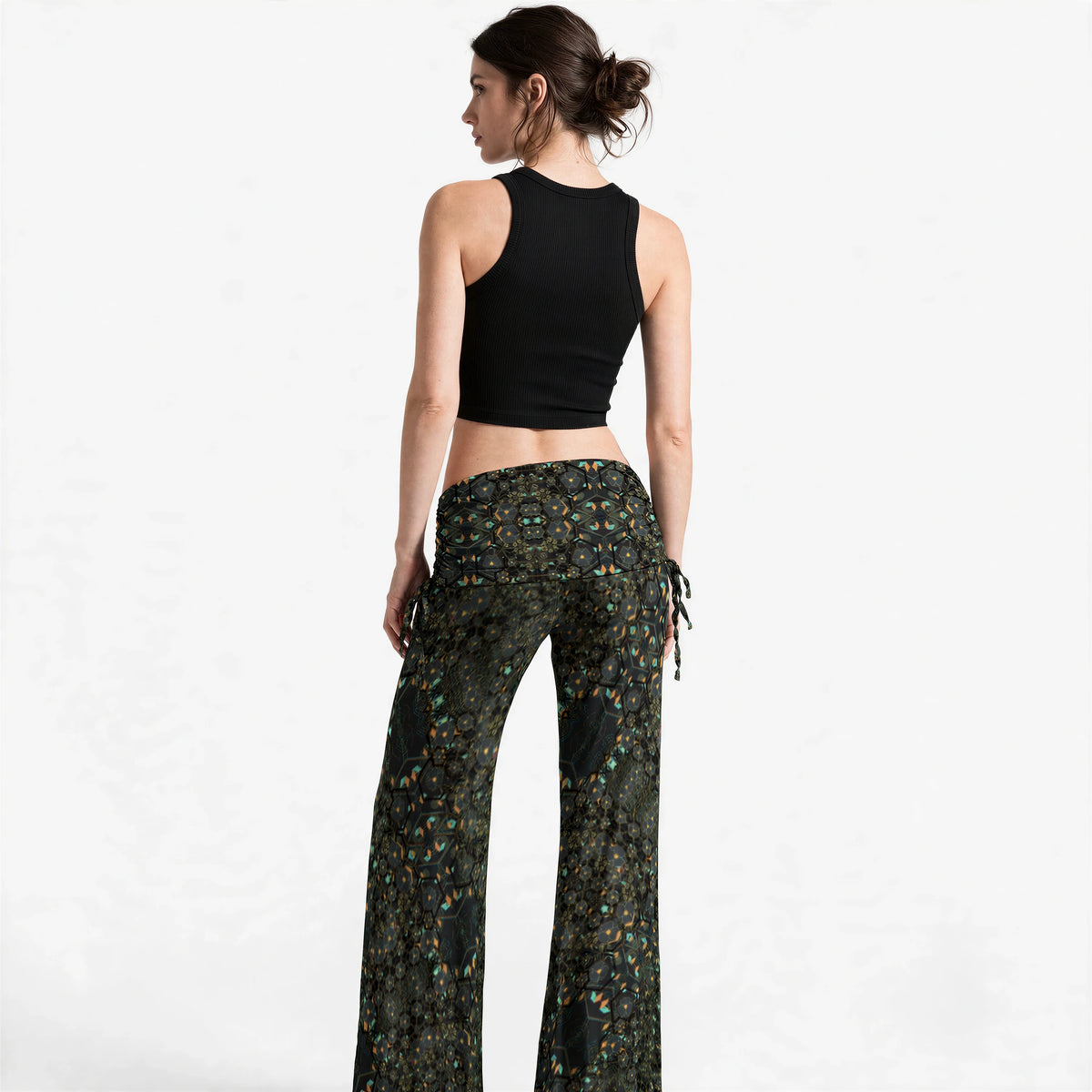Back view of the wide leg pants showing the symmetric mandala print across the seat and drawstring ties at each hip.