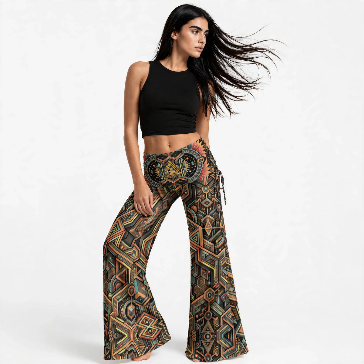 Three-quarter view showing the high-waist fit, flared wide legs and the circuit print wrapping around the body.